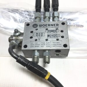 hydraulic valve manifold, progressive lubrication distributor, WOERNER VPB-B, industrial lubrication system, grease lubrication manifold, lubrication equipment, hydraulic system parts, machinery lubrication, VPB-B manifold, industrial machinery parts, automated lubrication, factory maintenance equipment, grease distribution valve, industrial hydraulic components, lubrication control system